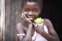 Angola, girl with lemon