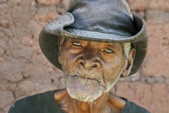 Angola, old man with hat