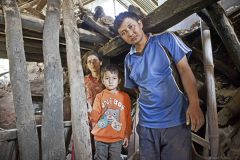 Nepal, Suseela with her family in the destroxyed house