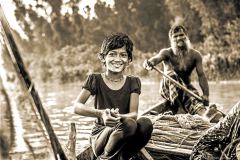 Bangladesh, girl and father on small boat