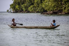 Philippines, Siargao, children on dugout boat