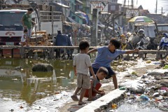 Philippines, Manila, children playing at water